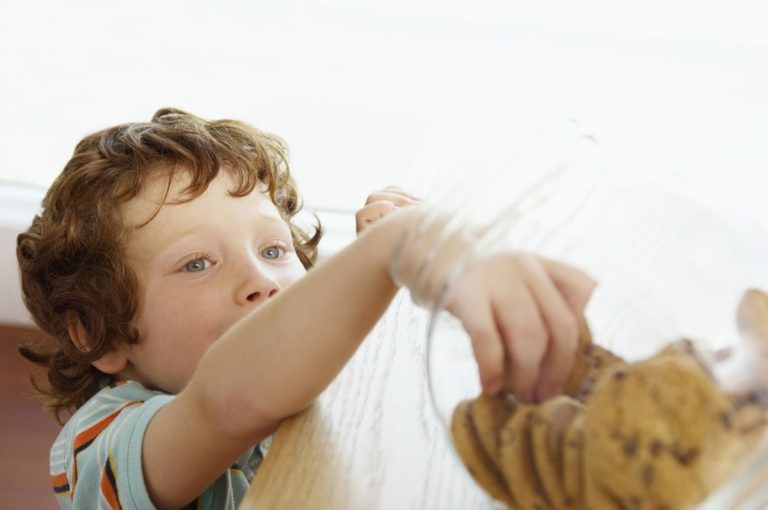 child taking cookies from the cookie jar featured image