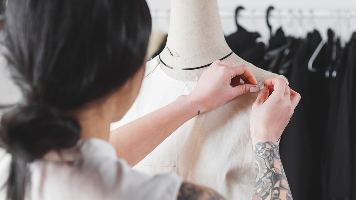 woman working on dress